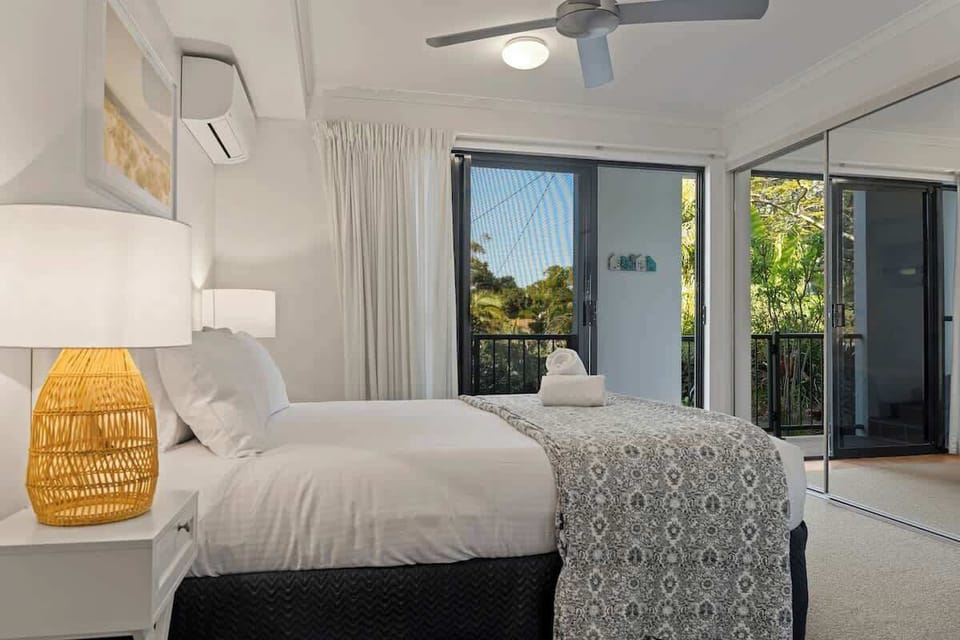 Wake up slowly in the sun-drenched primary bedroom, step out onto the balcony and take in the stillness before the day begins.