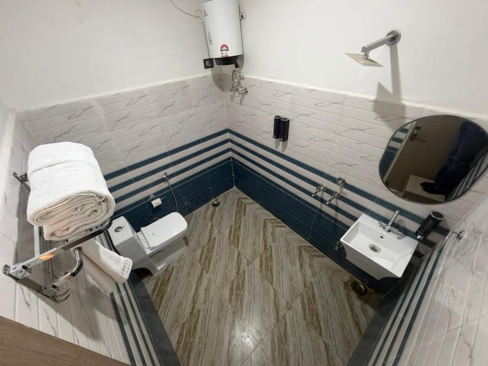Shower, towels, soap, toilet paper