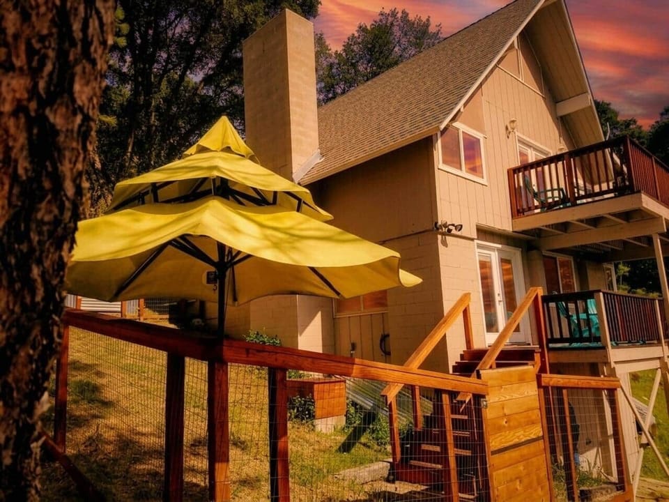 Welcome to your mountain cabin retreat — multiple decks perfect for sipping wine under the sunset sky