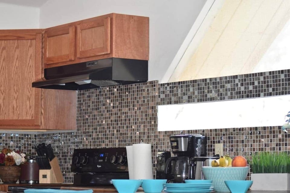 Fully equipped kitchen with coffee maker and everything you need — prep a picnic and take it to the river