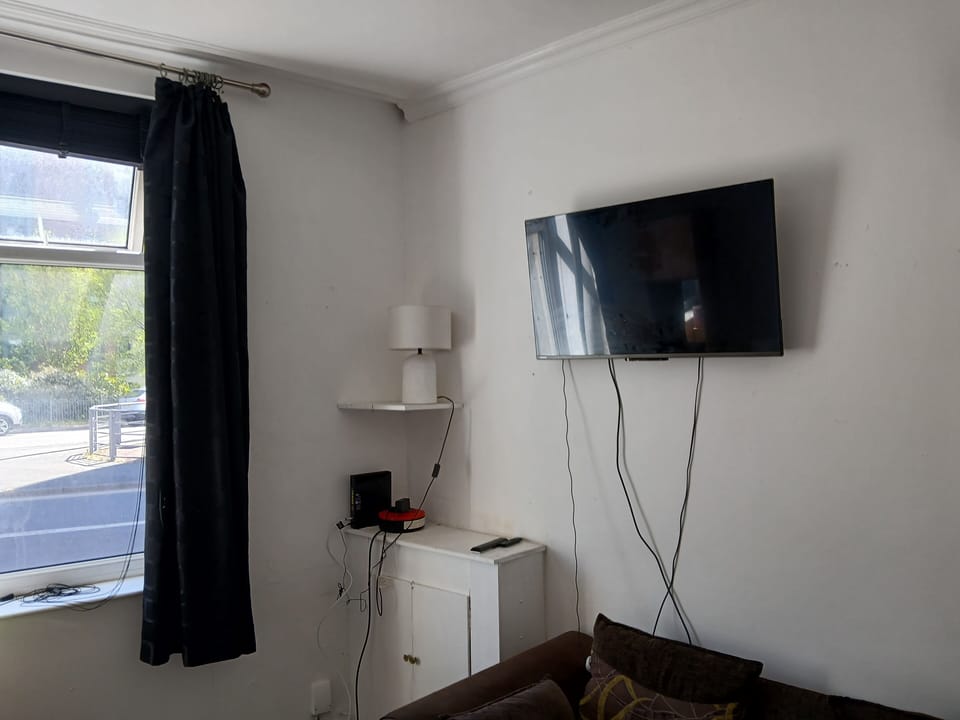 Double Room, Courtyard View | Living area | TV