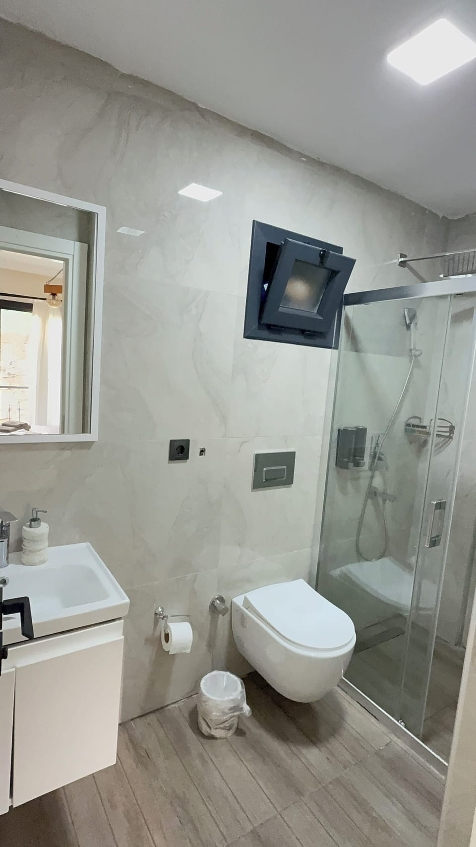 Shower, hair dryer, slippers, towels