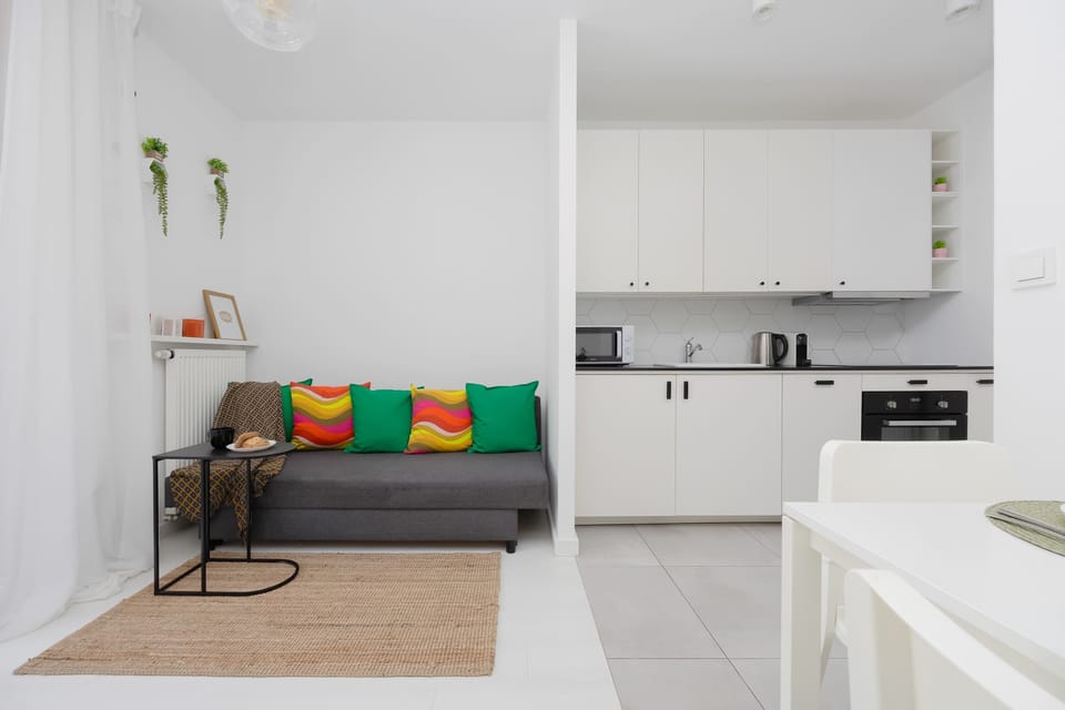 A combined living and kitchen area with open space, bright tones, and a welcoming layout.