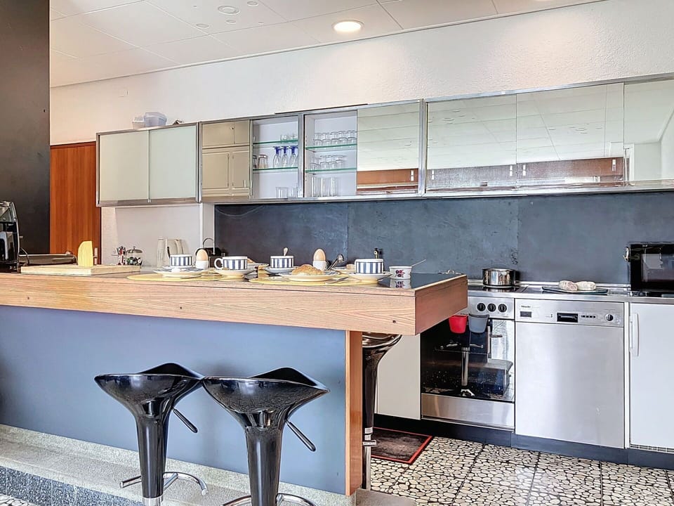 Furniture, Kitchen, Countertop, Interior Design, Flooring, Kitchen Appliance, Cabinetry, Wood, Floor, Lighting