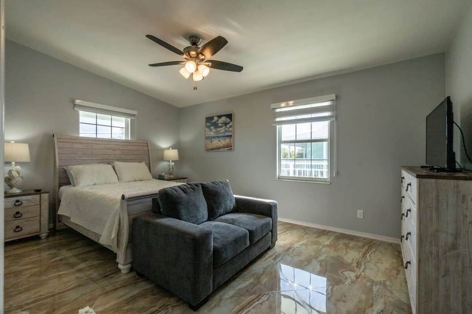 Bedroom 3 has a king bed, TV, sofa, and room to relax. 