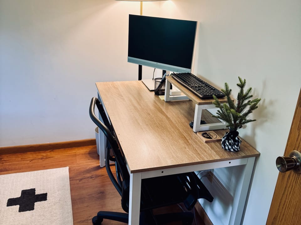 Flexible workspace includes fiber internet, monitor and wireless keyboard/mouse.
