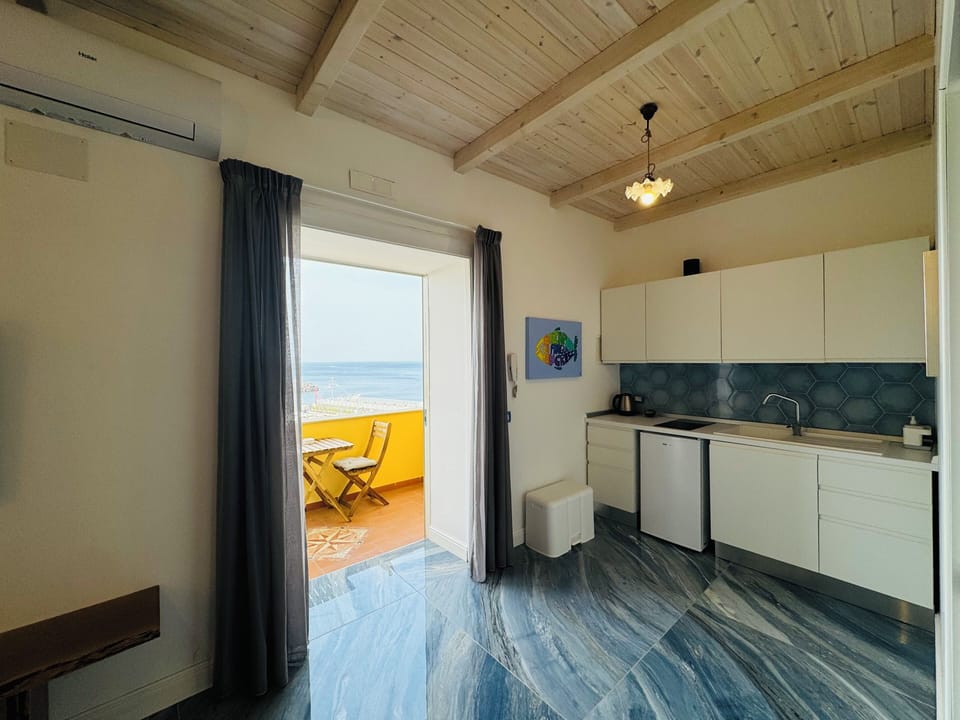 Apartment, Balcony, Sea View | Private kitchen | Fridge, electric kettle, cookware/dishes/utensils