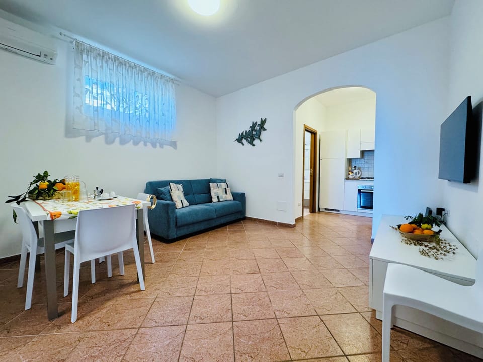 Apartment, Partial Sea View | Living area | 32-inch flat-screen TV with digital channels