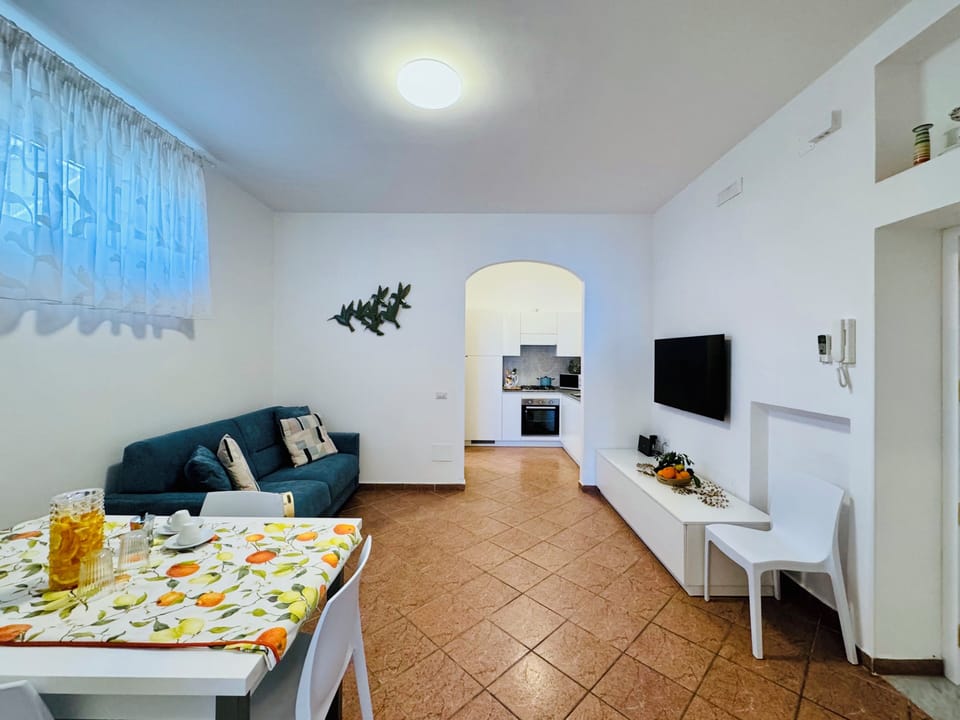 Apartment, Partial Sea View | Living area | 32-inch flat-screen TV with digital channels