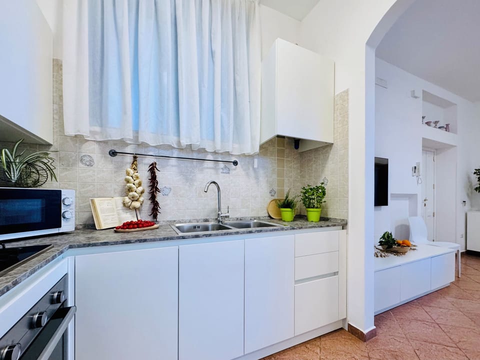 Apartment, Partial Sea View | Private kitchen | Full-size fridge, microwave, oven, stovetop