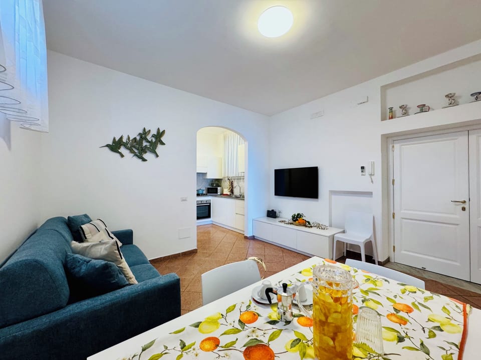 Apartment, Partial Sea View | Living area | 32-inch flat-screen TV with digital channels