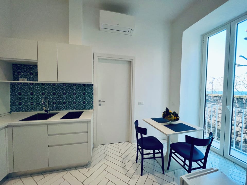 Apartment, Balcony, Partial Sea View | Private kitchen | Microwave, stovetop, espresso maker, electric kettle