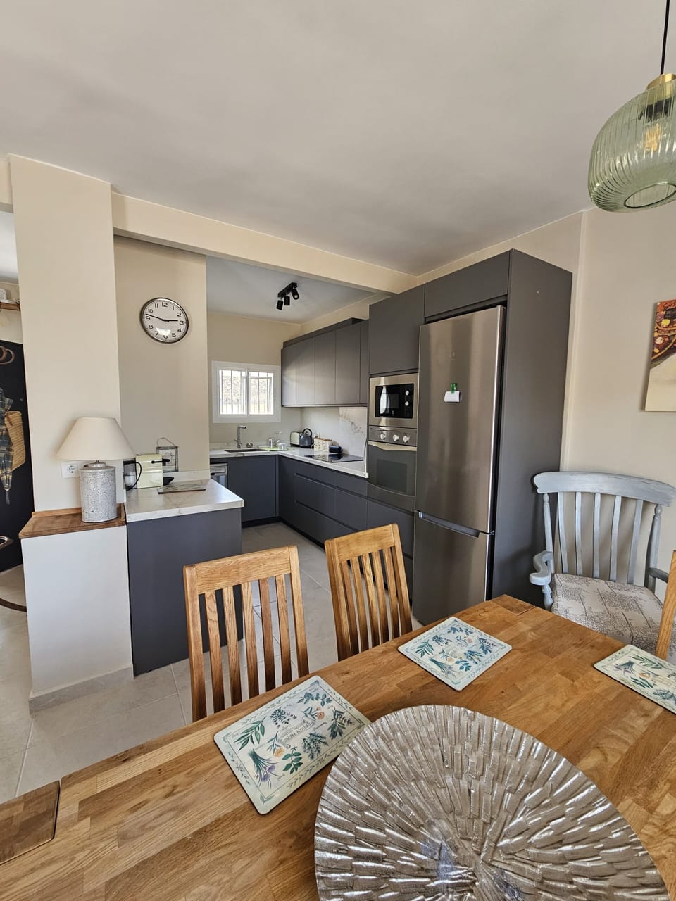 spacious open plan ground floor, with sofas and dining seating for 6