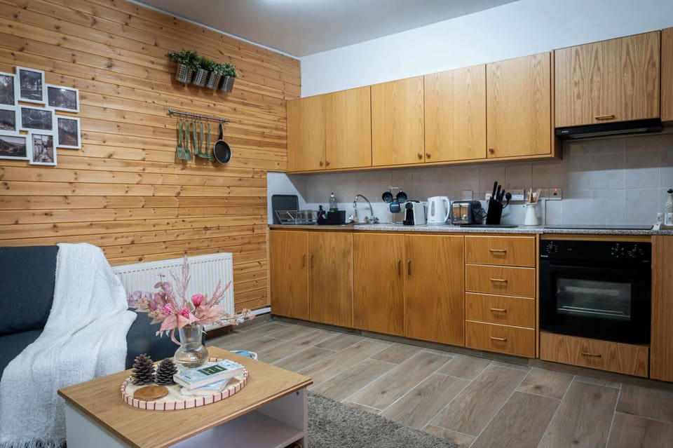 A bright, open-plan kitchen and living area with all the amenities you need to cook, dine, and unwind with ease after a day out.
