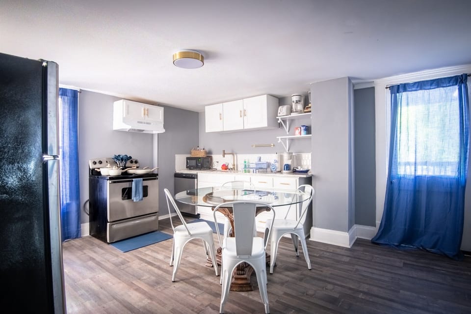 Whip up something simple or start your day with coffee in this cozy, functional kitchen—fully equipped with the essentials, including a dishwasher for easy cleanup.