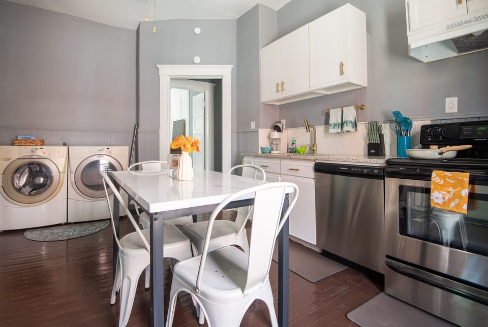 You’ll love how open and functional this kitchen feels from the moment you walk in. Prepare meals with ease, then sit down and relax in the cozy dining space. The bright, clean design makes it a joy to spend time here.
