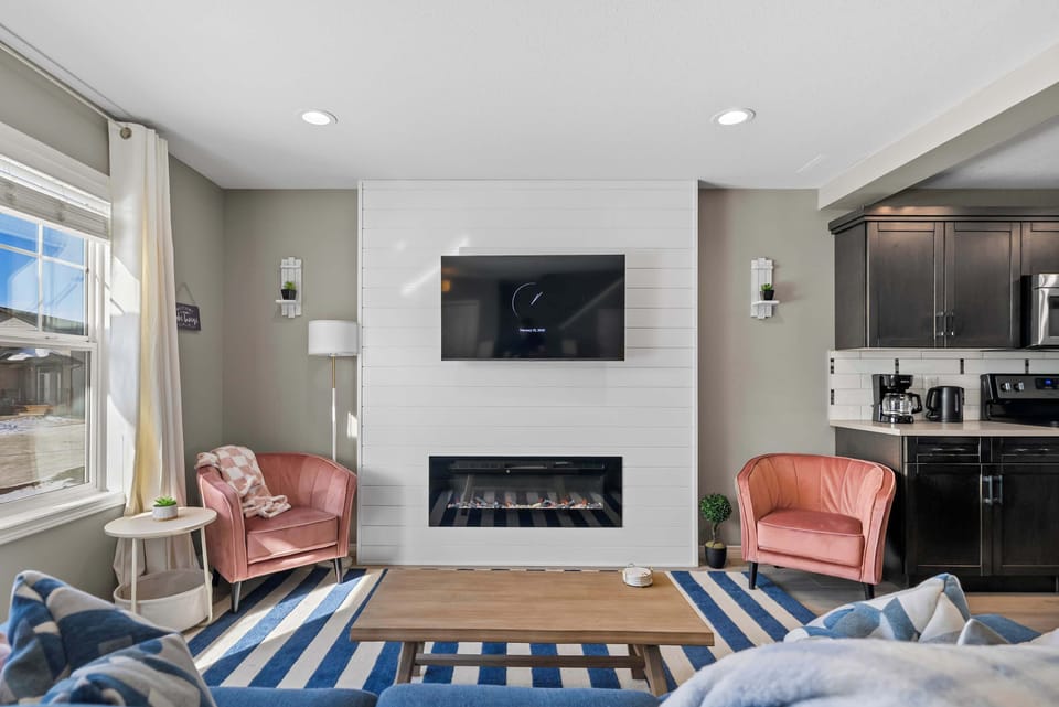 Cozy setup with TV &  fireplace for relaxing nights