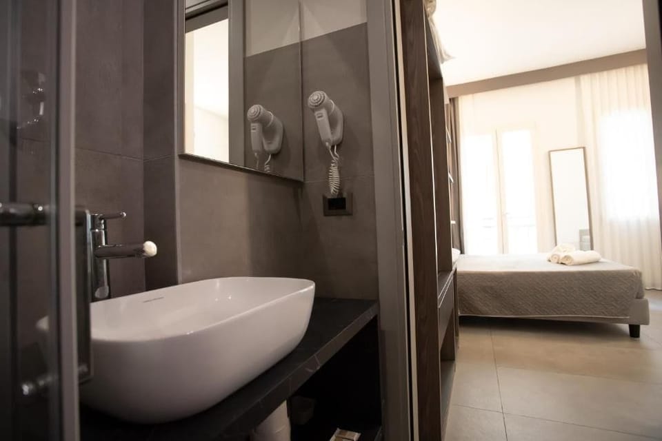 Deluxe Room, Balcony, Partial Sea View | Bathroom | Shower, hair dryer, towels, soap