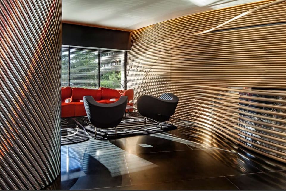 Recharge in a quiet corner lounge with textured, designer walls.