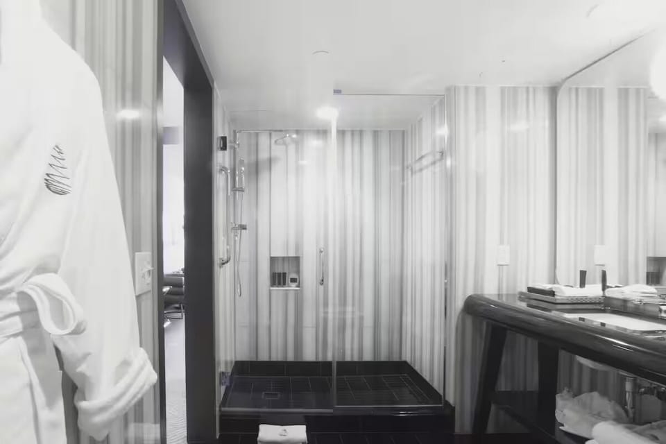 Refresh in a spa-like bathroom with a spacious walk-in shower.