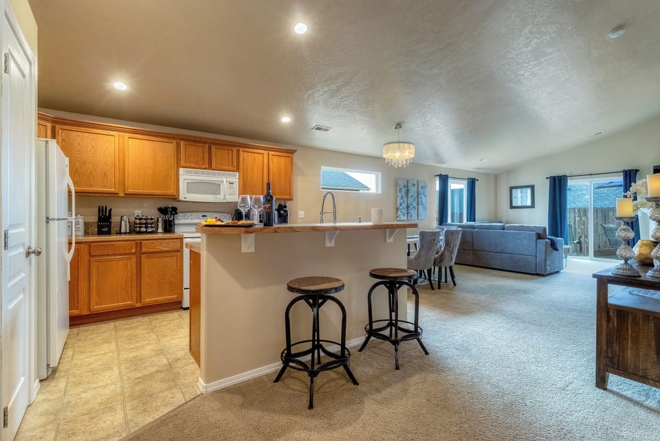 Breakfast bar and open layout keep everyone connected with ease.