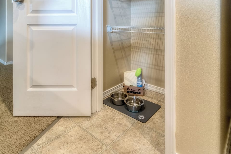 Pet station with food and water bowls for four-legged travel companions.