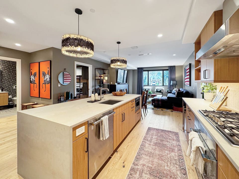 Who needs a restaurant? A gas stovetop, sprawling island, and every tool you need make in-home meals feel like an event. Open to the living area, because good food is better together.