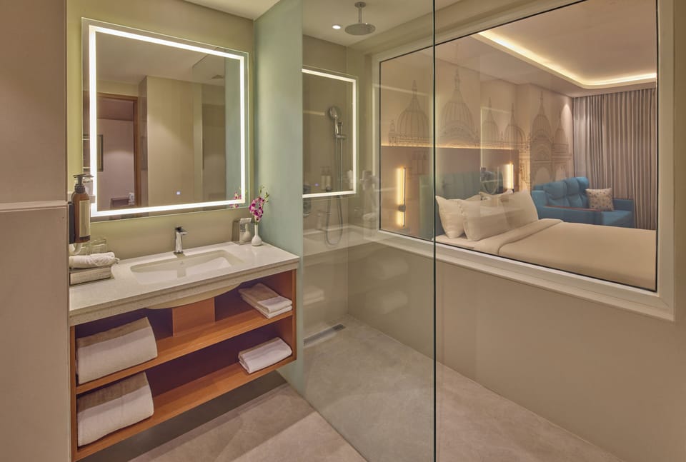 Suite | Bathroom | Shower, hair dryer, soap, shampoo