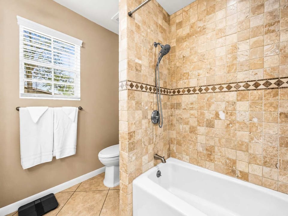 Bathroom Retreat: Modern tile finishes and light-filled views for refreshing moments!
