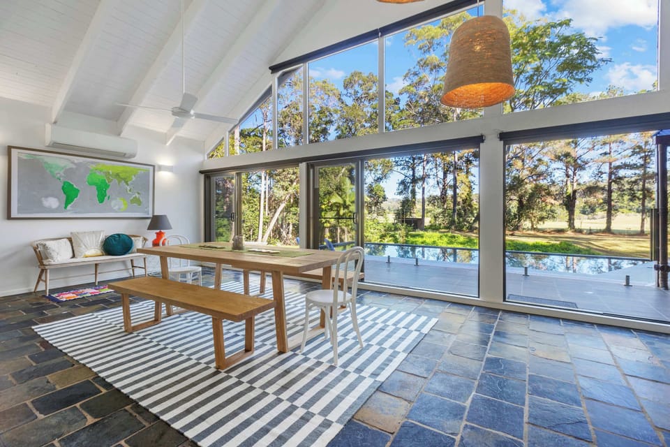 Enjoy open plan living beneath soaring timber ceilings