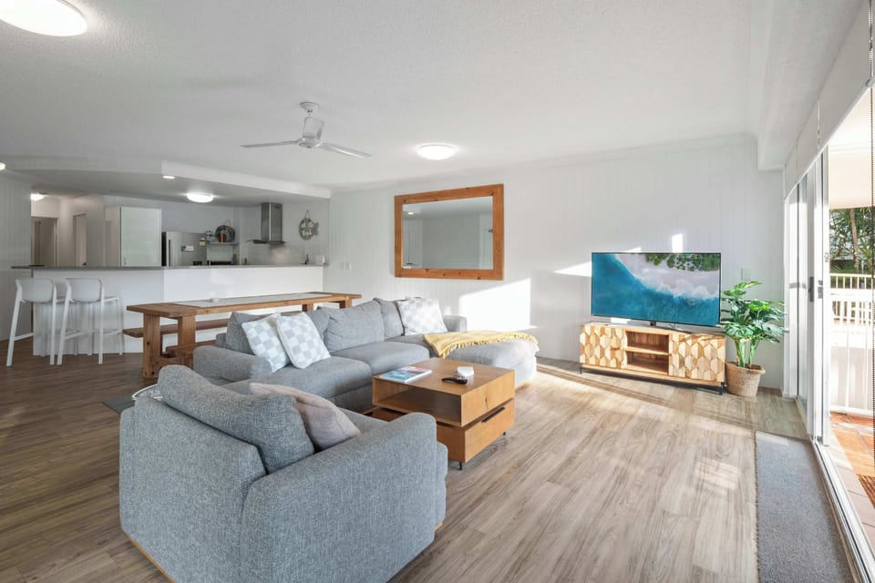 The bright and airy lounge offers ample space to stretch out, perfect for lazy mornings or movie nights.