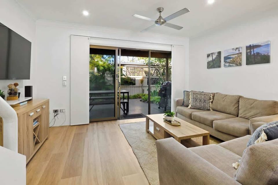 Relax in the open-plan living area, styled for slow, easy days at home.