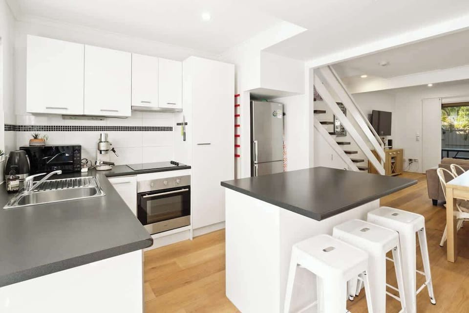 Whether you're prepping a big breakfast or light dinner, the modern kitchen makes cooking effortless.