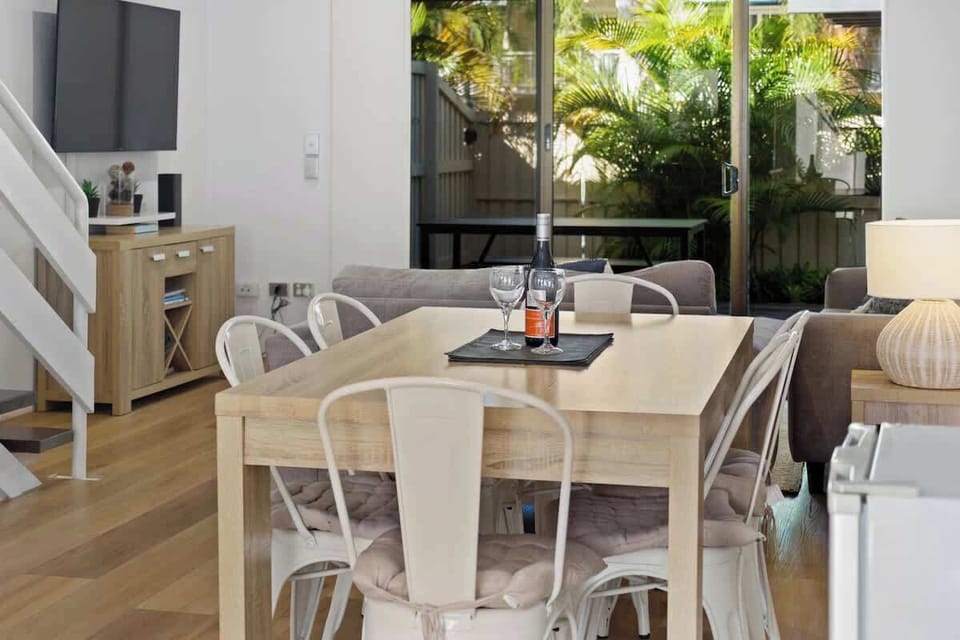 Share meals at the indoor dining table with courtyard views and space for everyone to sit back and relax.