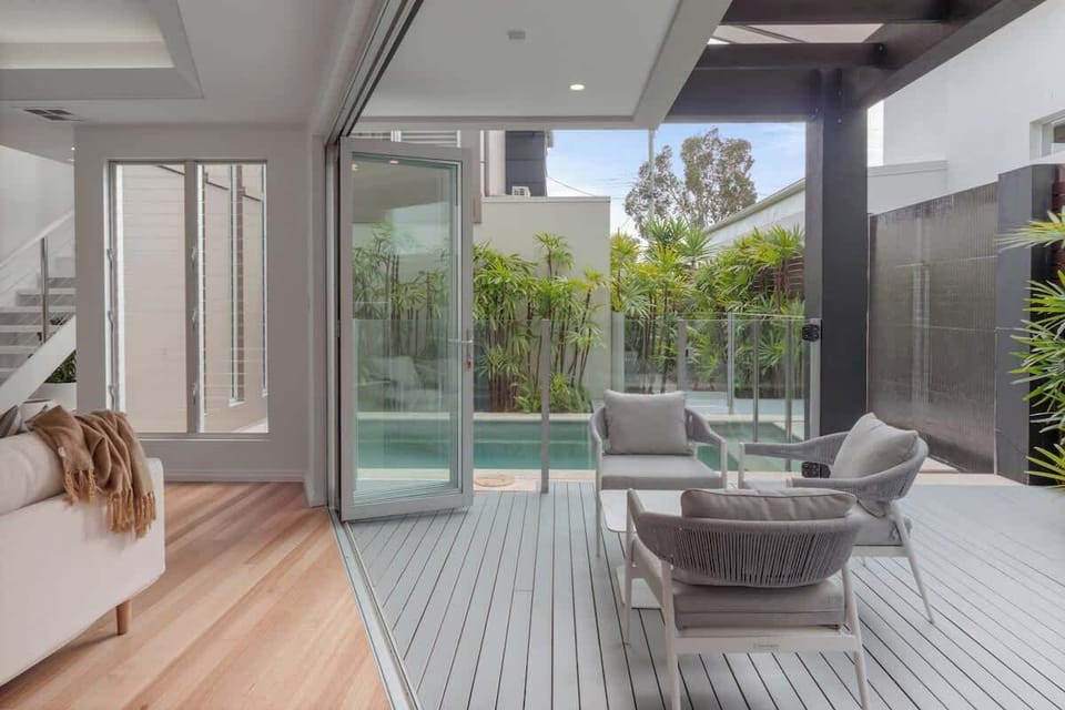 Large bifold doors open up from the living area onto the deck which overlooks your private pool and gardens.