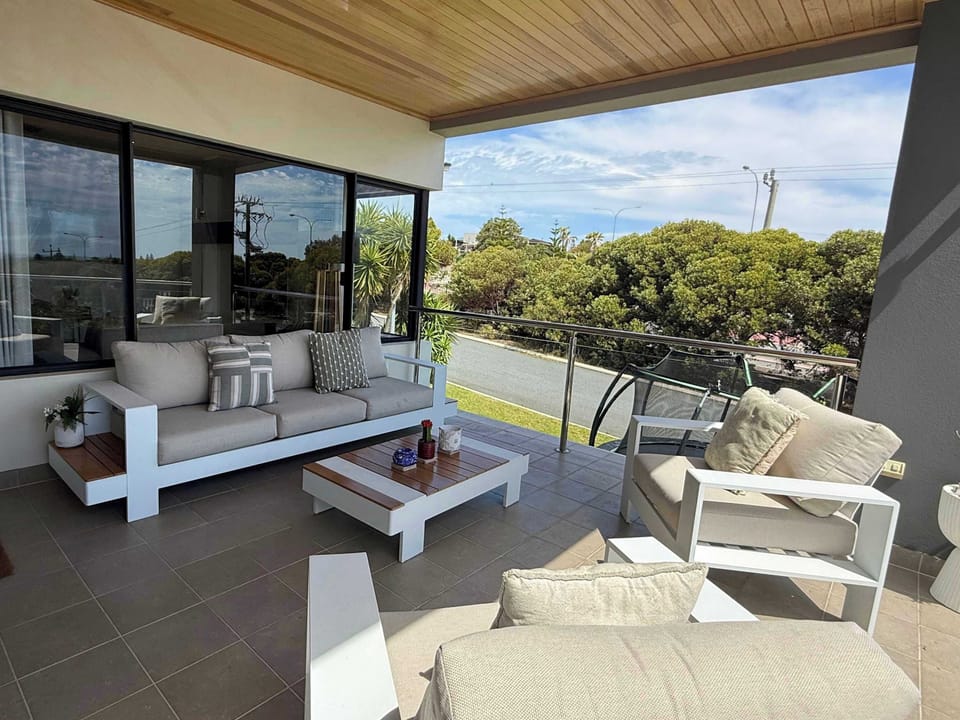 Step onto your private balcony and breathe in the fresh air! This beautiful outdoor space features elegant furniture and is framed by stunning tree views, offering a peaceful, private retreat. Perfect for guests seeking tranquility and natural beauty