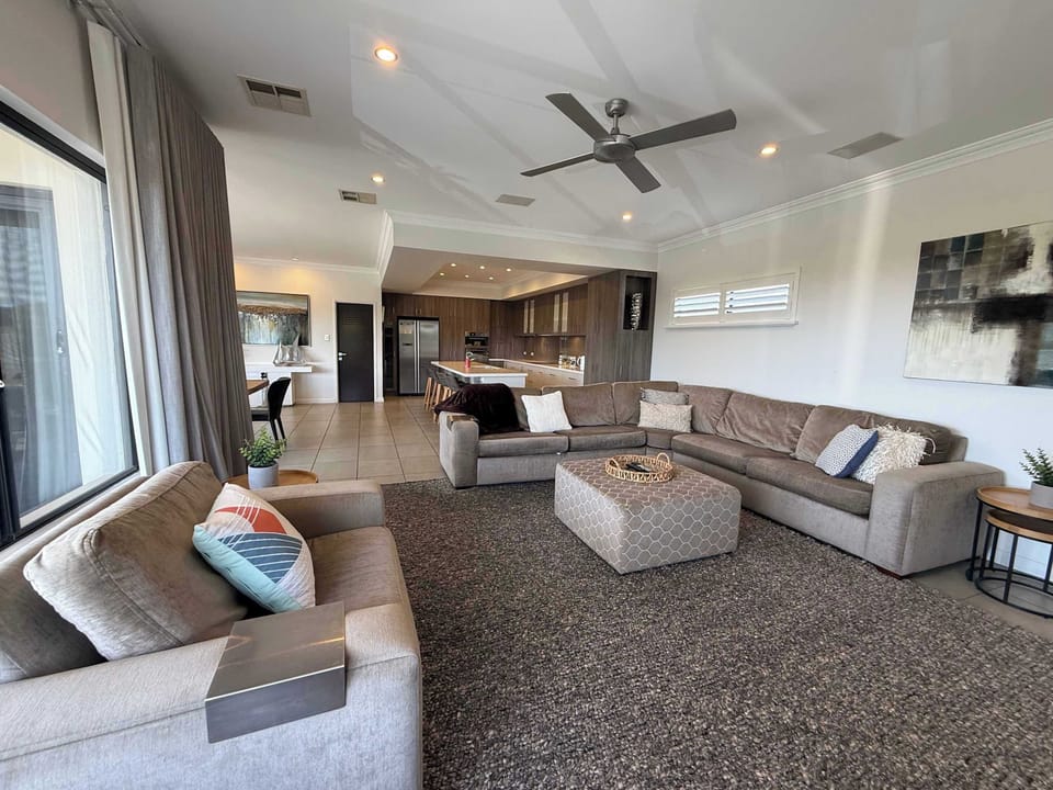 Bright open-plan layout with a cozy living area, stylish dining space, and modern kitchen—perfect for effortless relaxation and entertaining.