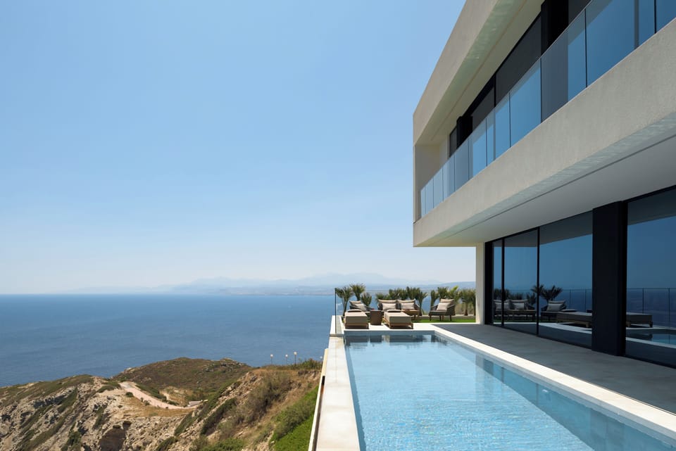 200 m² poolside living, 20x3.5m infinity pool, fire pit, swim-up beds, sea views