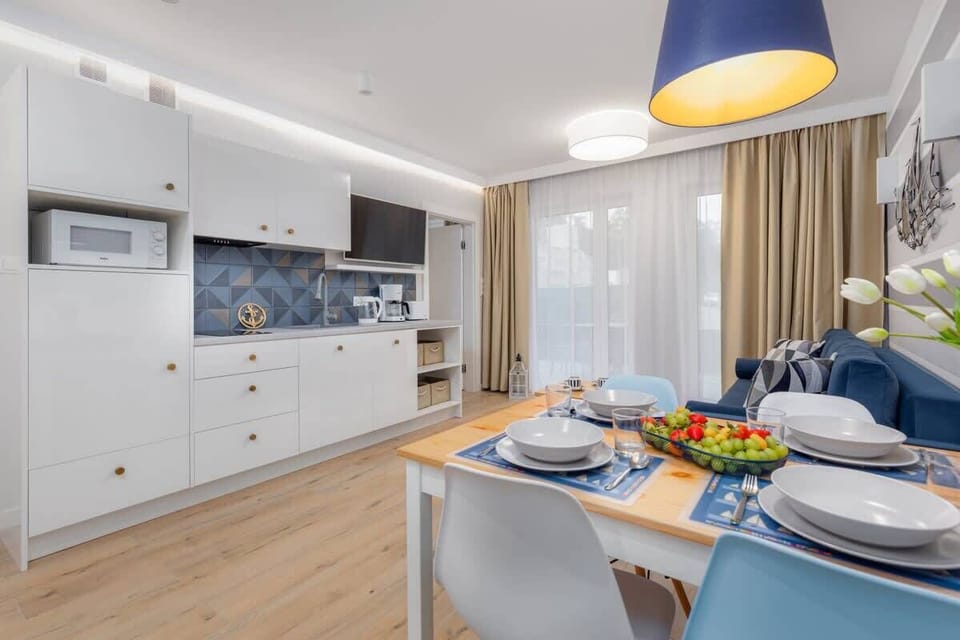 A wide view of the living and kitchen areas, showing the harmonious blend of functionality and style.