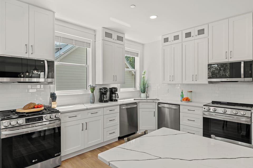 Fully equipped kitchen with stainless steel appliances.