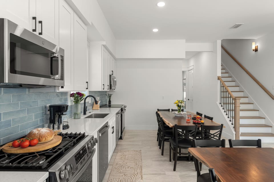 Gallery view of the kitchen leading into the formal dining space.