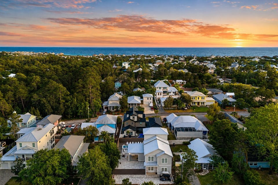 Aerial neighborhood view showing the home’s proximity to the beautiful coastline.