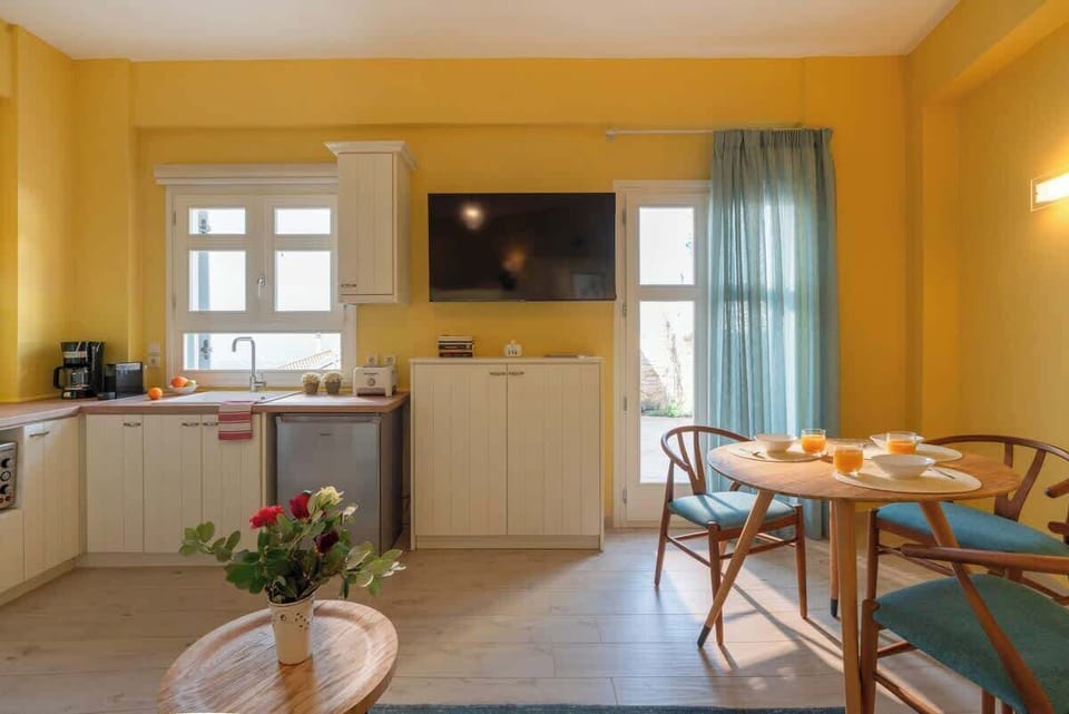 Fully equipped kitchenette with scenic window views