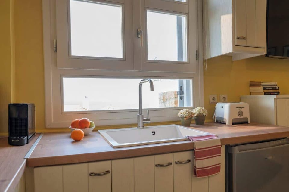 Equipped kitchenette with scenic window views