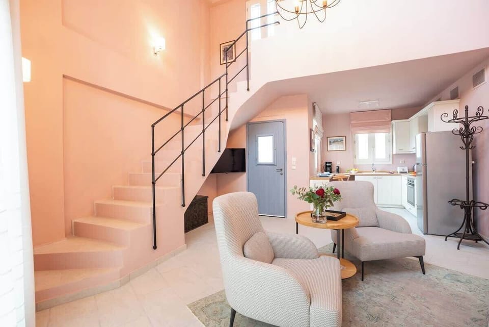 Contemporary lounge with staircase leading to the top floor