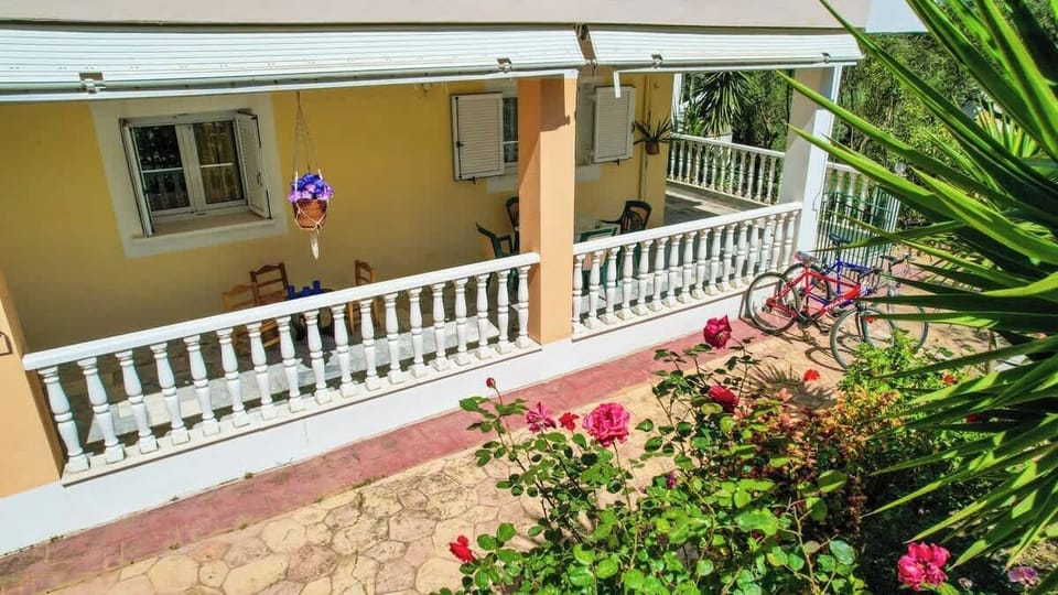 Exterior balcony with garden views.