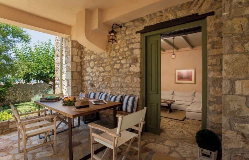 Covered terrace with outdoor dining and relaxing lounge area