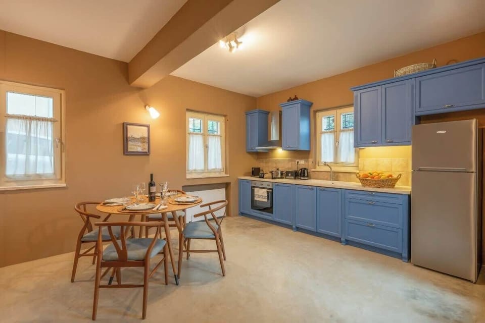 Fully equipped kitchen with dining area, perfect for shared meals.