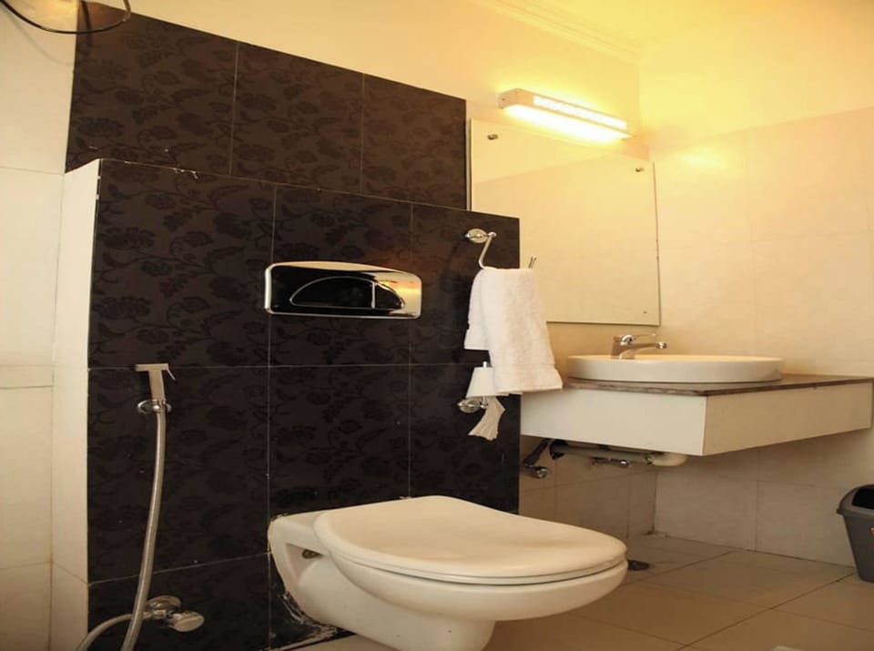 Shower, rainfall showerhead, slippers, towels