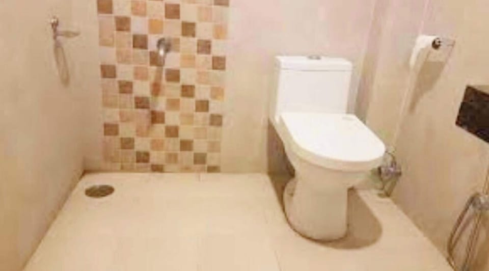 Shower, rainfall showerhead, slippers, towels